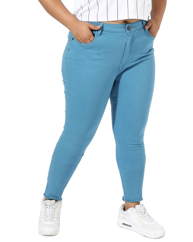 Side of a model wearing a size 40 Solid Blue Skinny Jeans in Blue by Instafab Plus. | dia_product_style_image_id:297974